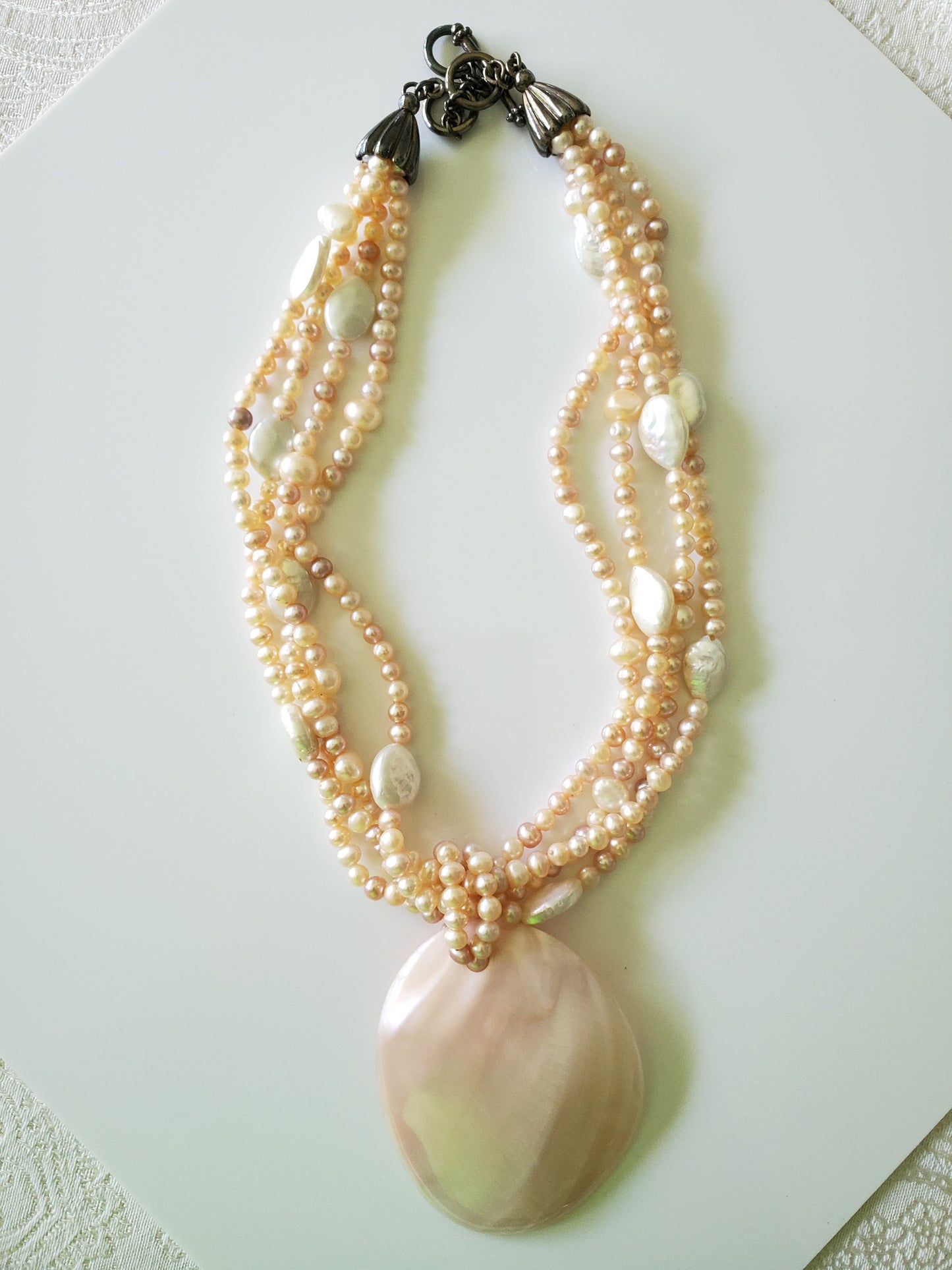 Multi-strand Pink and Cream Freshwater Pearls with Large MOP Pendant