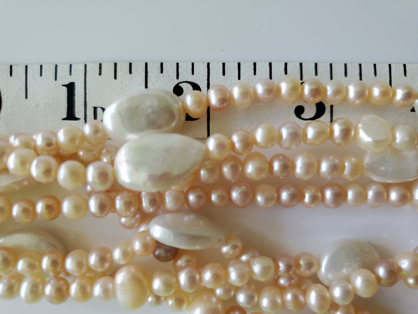 Multi-strand Pink and Cream Freshwater Pearls with Large MOP Pendant