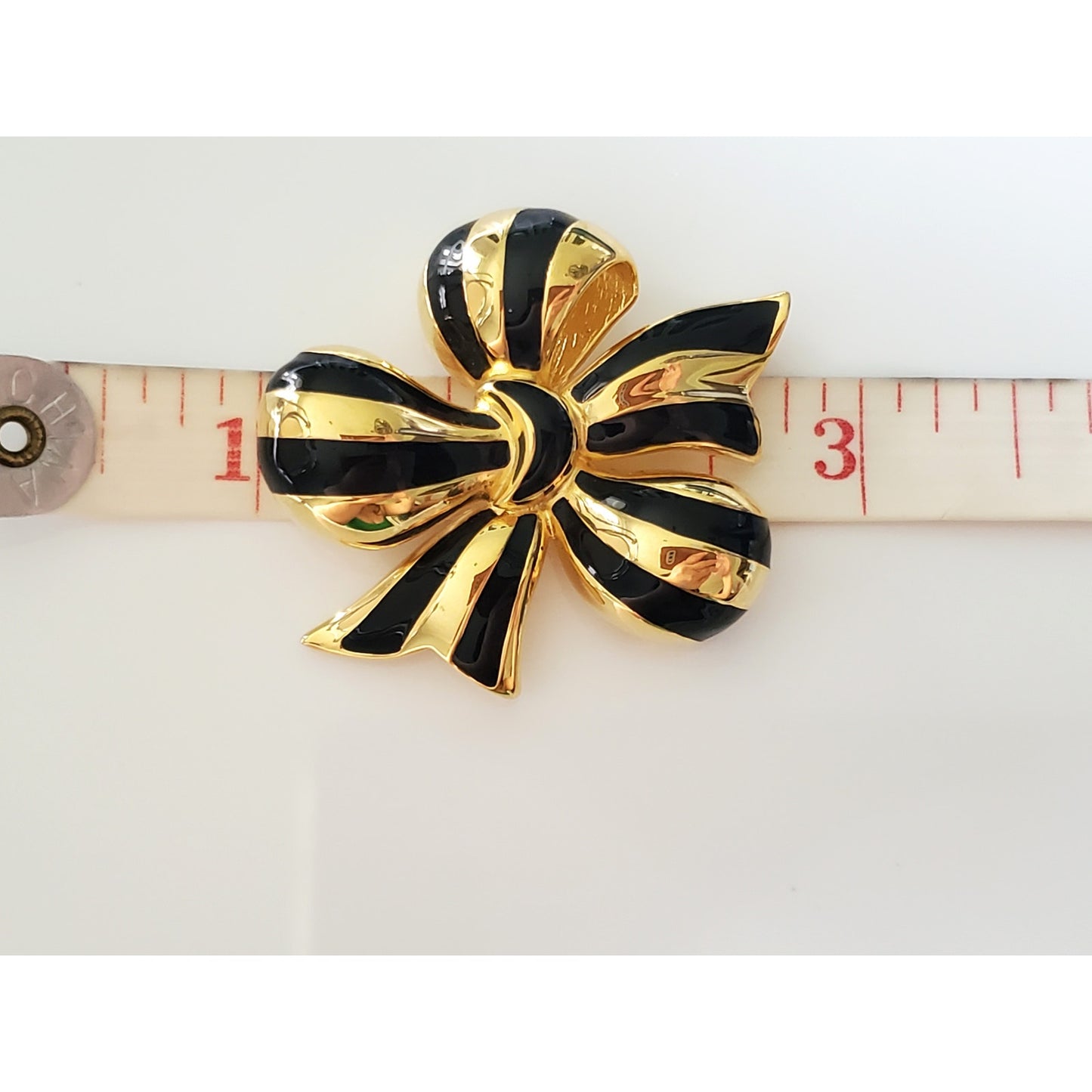 Vintage Joan Rivers Black and Gold Ribbon Brooch