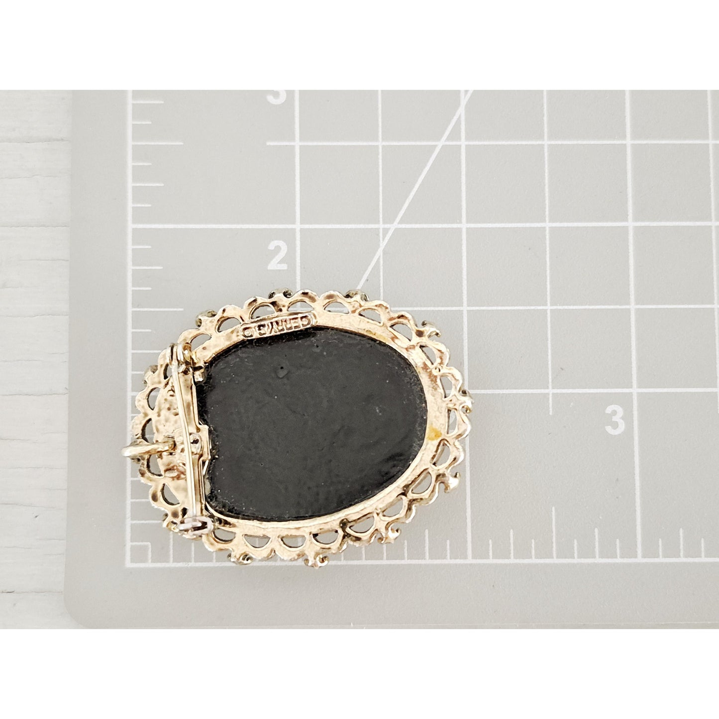 Vintage Gerrys Black and White Floral Resin Cameo Brooch