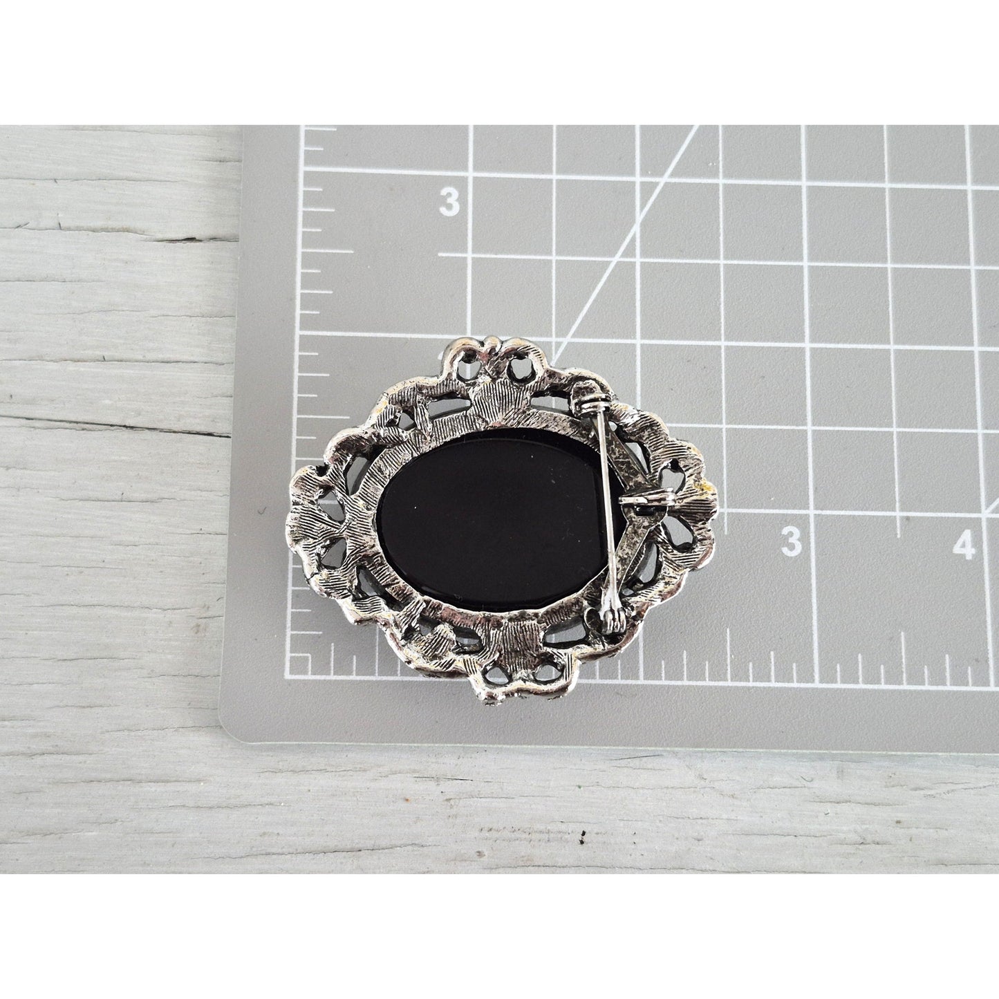 Vintage Black Glass and Mother of Pearl Cameo Brooch